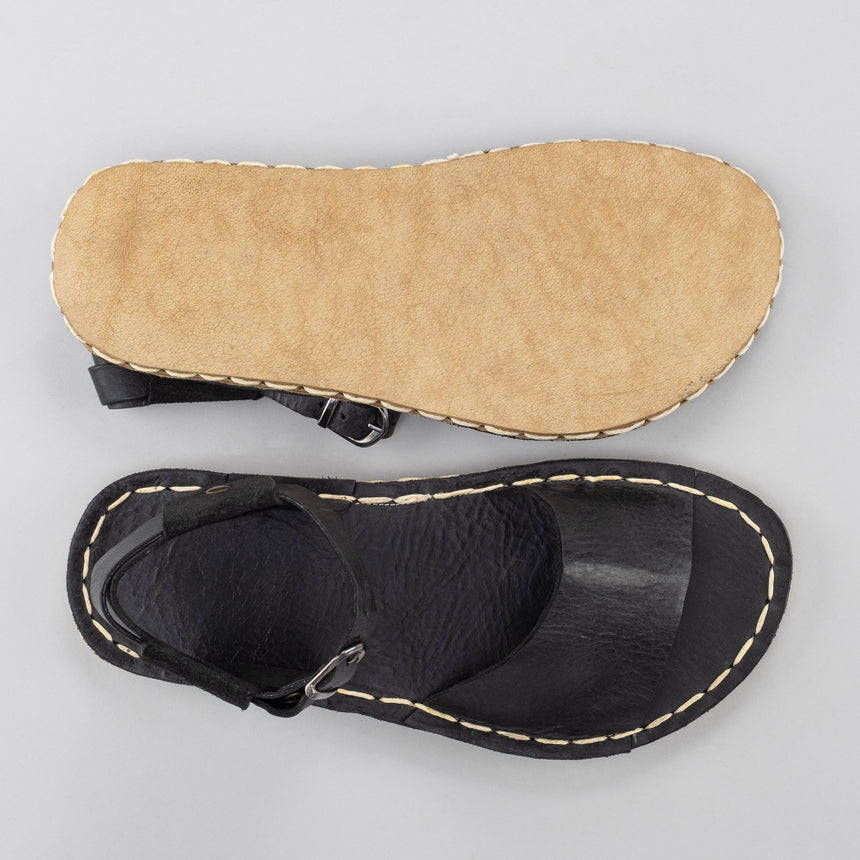 Schwarze Barfußsandalen mit offener Spitze